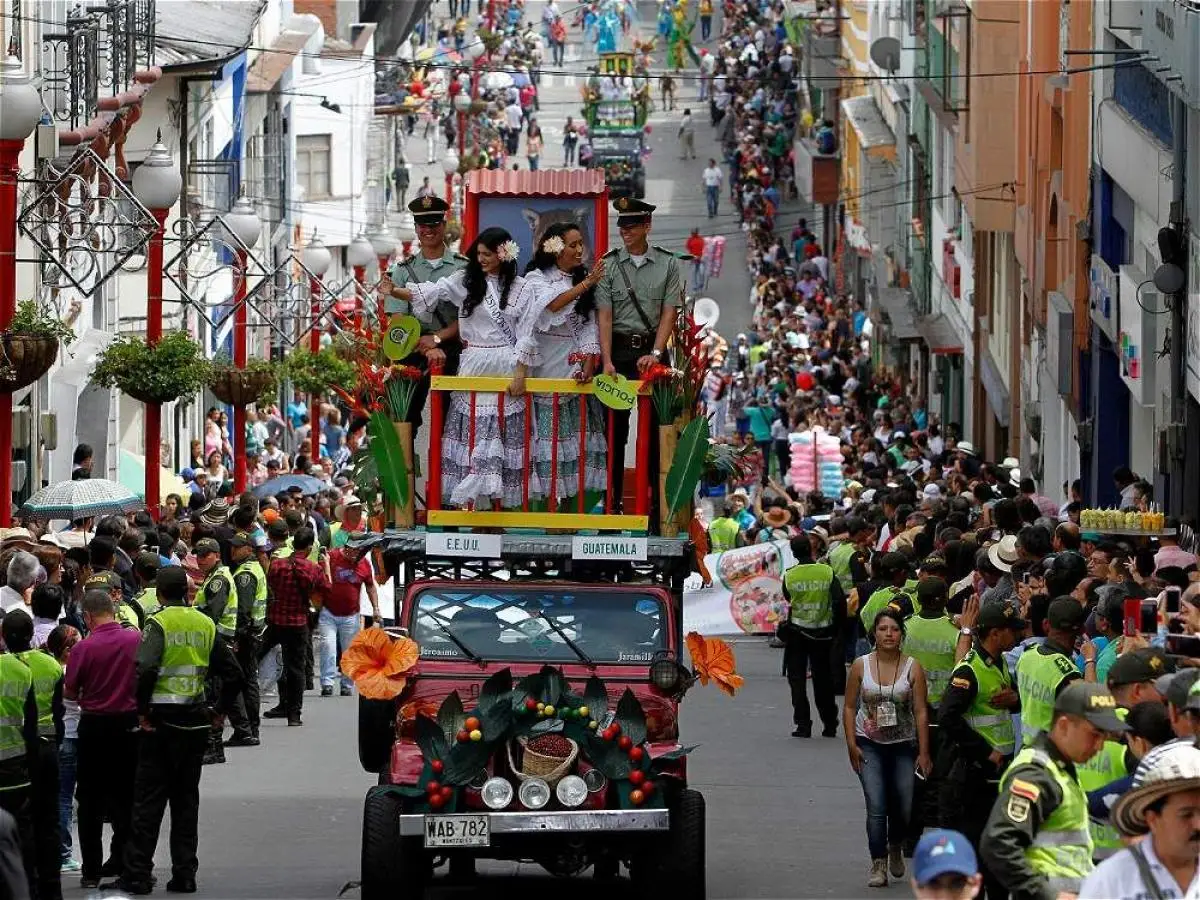 Crowd watching a caravan passing by